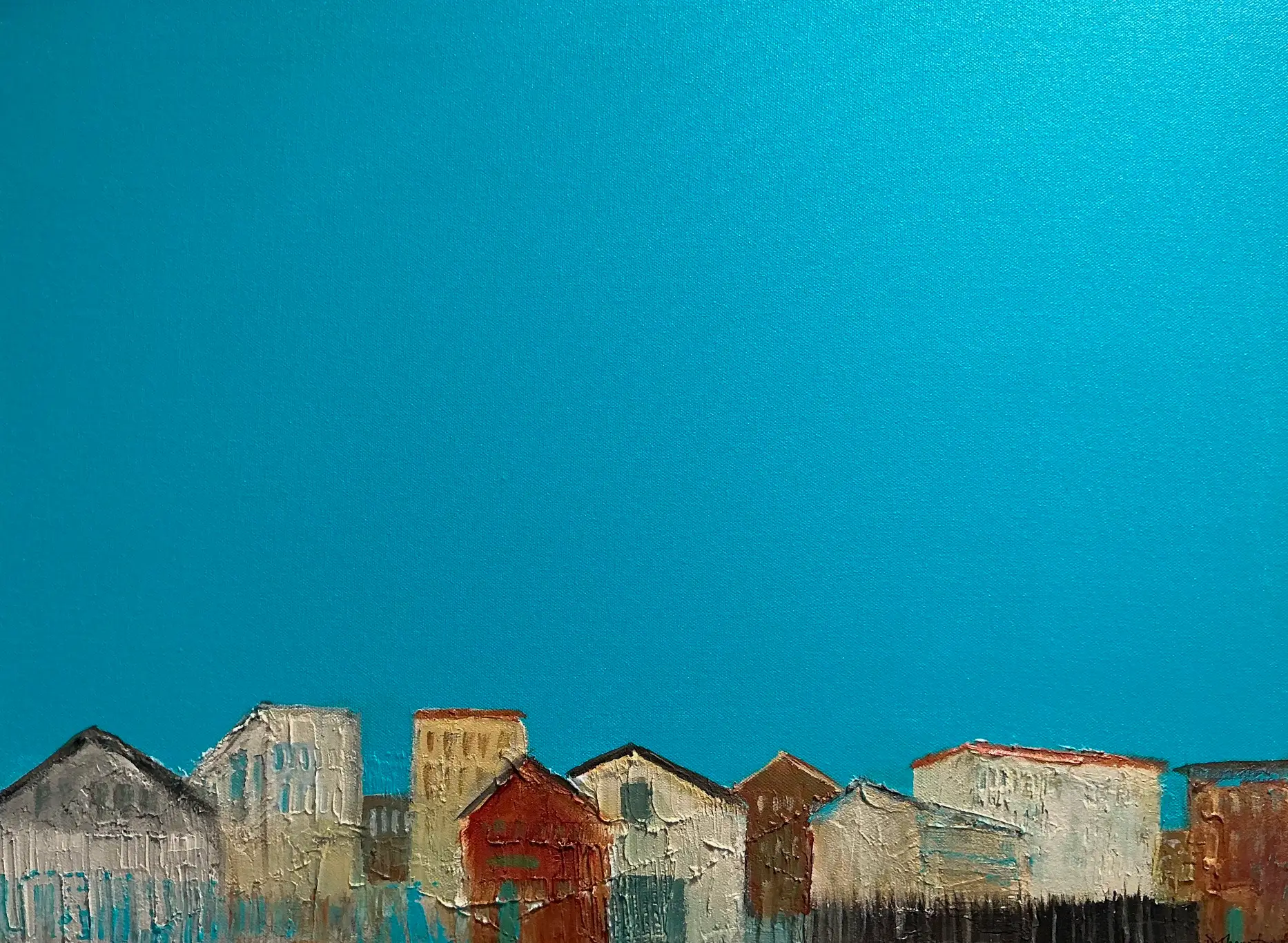abstract painting with teal background and white and brown shapes at the bottom of the canvas