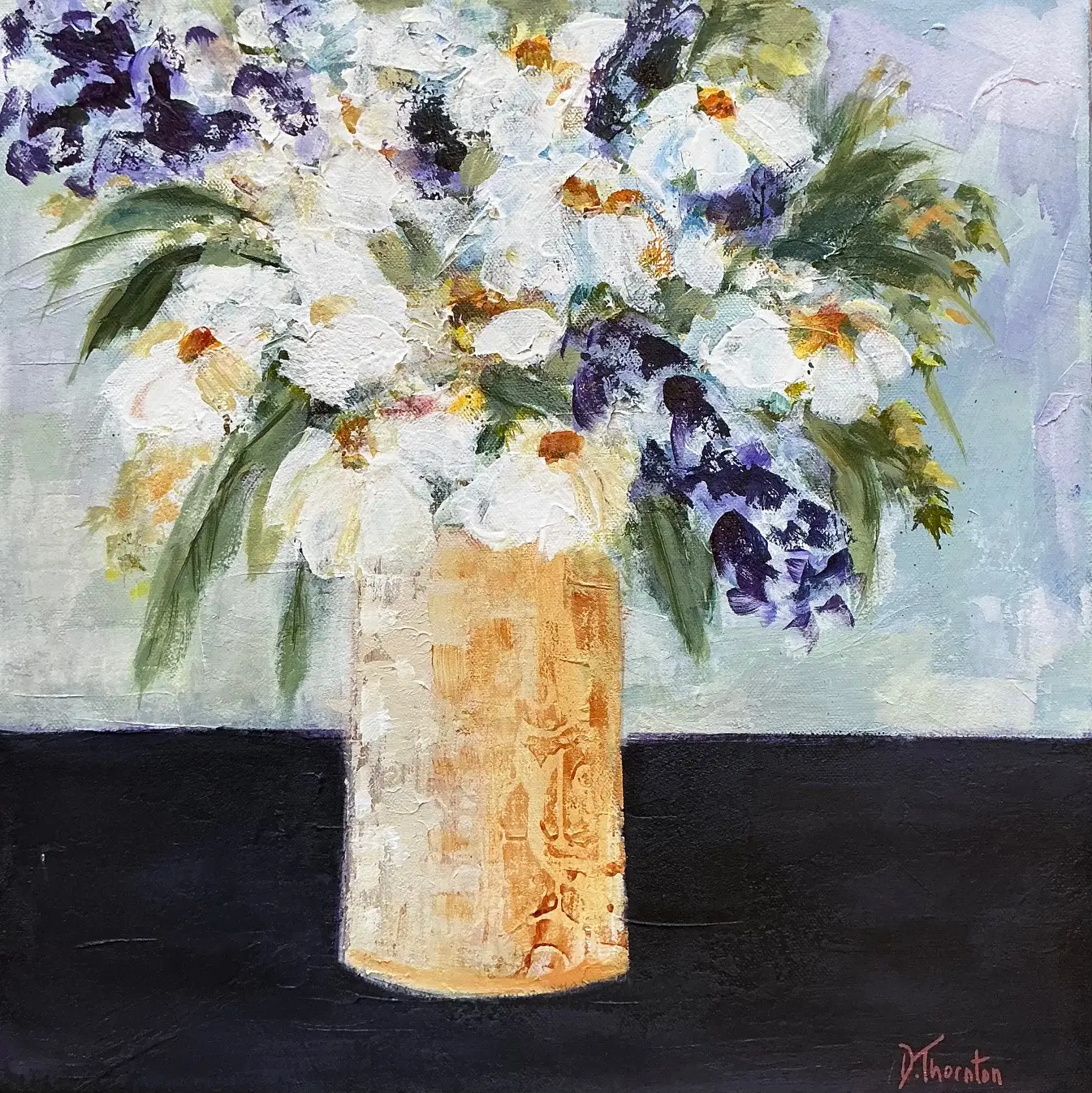 vase of flowers on black table